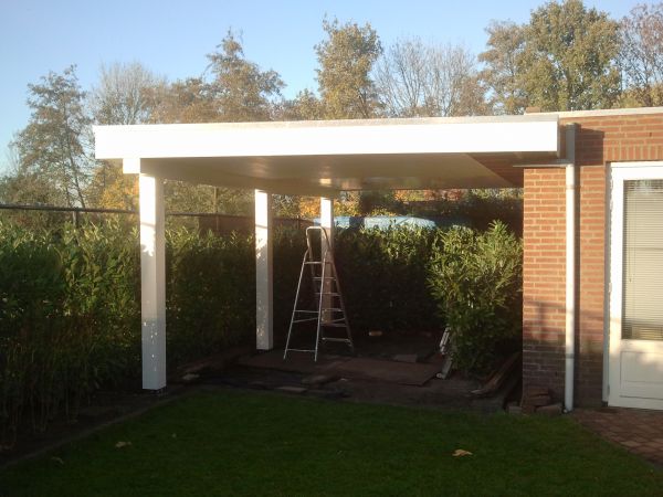 Overkapping maken balk dubbelsteense garagemuur bevestigen